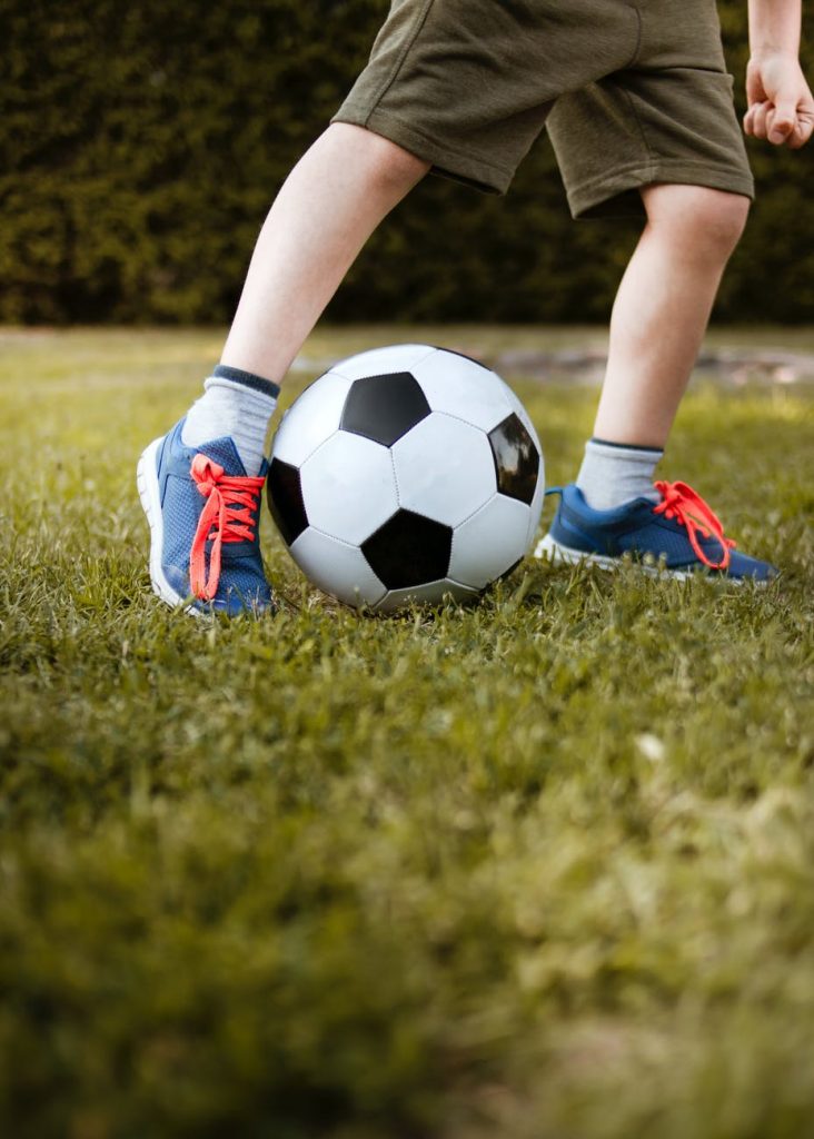 boy playing with soccer ball